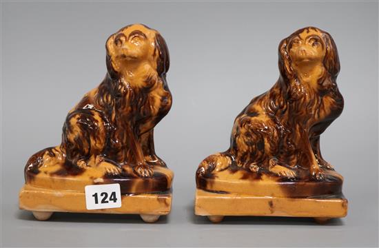 Two treacle ware dogs height 18cm